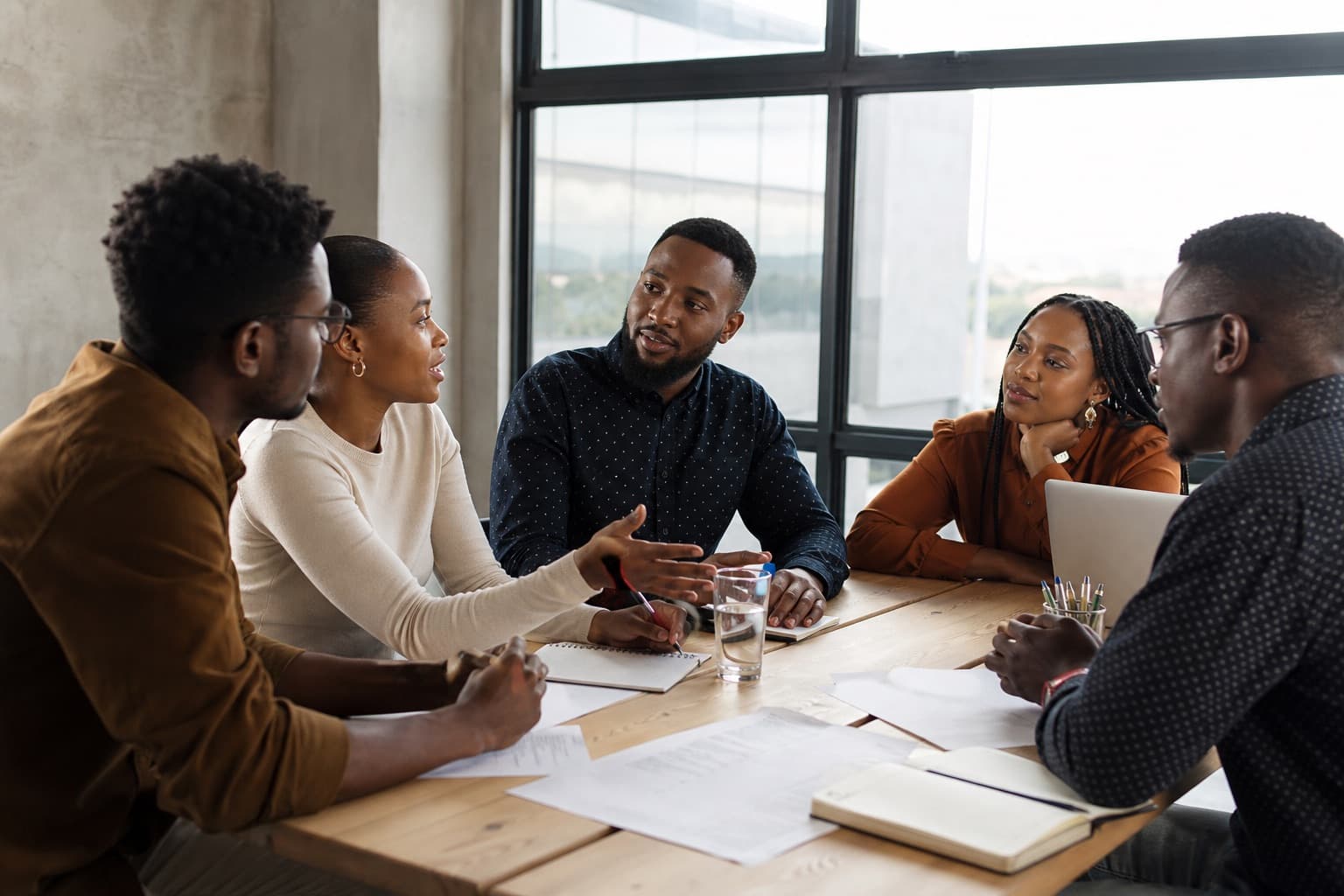 Young South African professionals in conversation during a workshop
